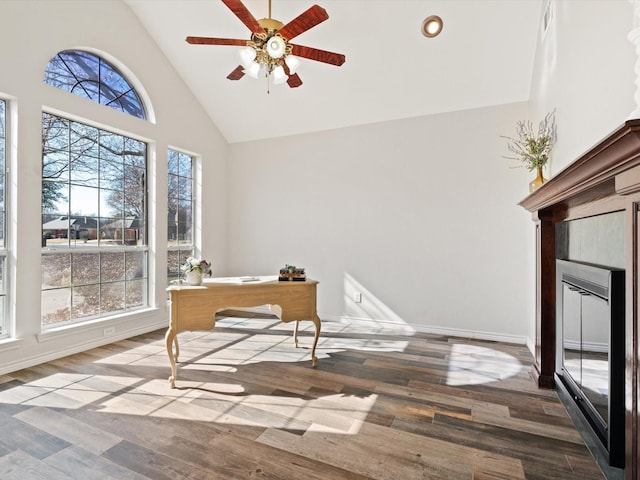 office with hardwood / wood-style flooring, a wealth of natural light, and high vaulted ceiling