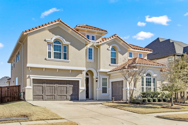 mediterranean / spanish house featuring a garage