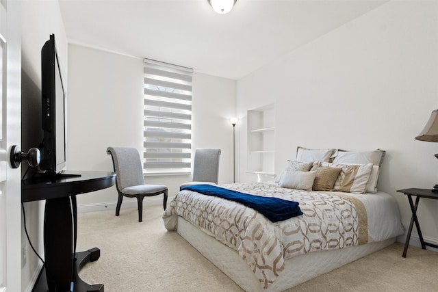 bedroom featuring light colored carpet