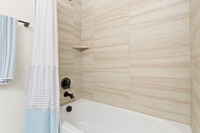 bathroom featuring shower / bath combo with shower curtain