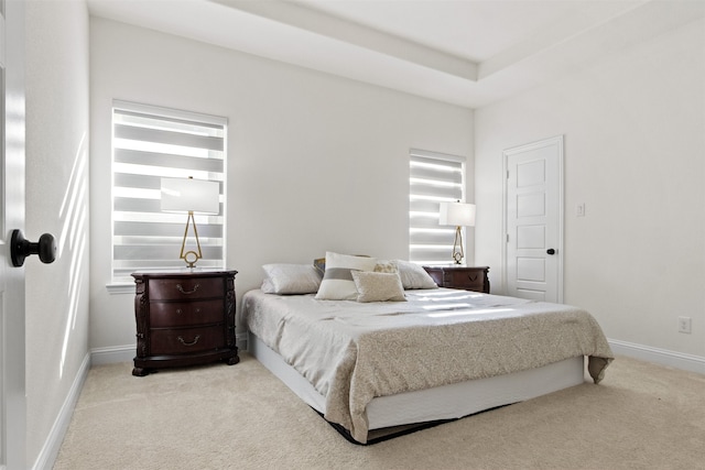 bedroom featuring light colored carpet