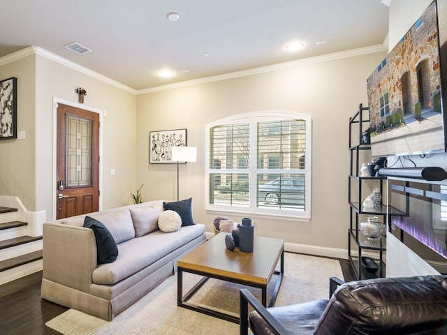 living room with crown molding and wood-type flooring