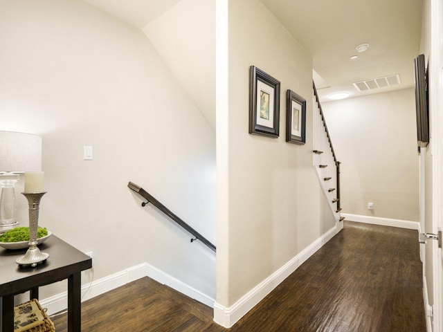 staircase featuring wood-type flooring