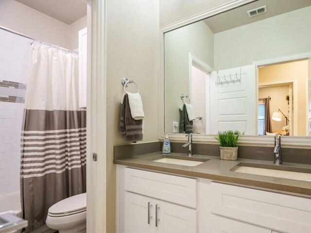 bathroom with vanity, a bath, tile patterned flooring, and tile walls