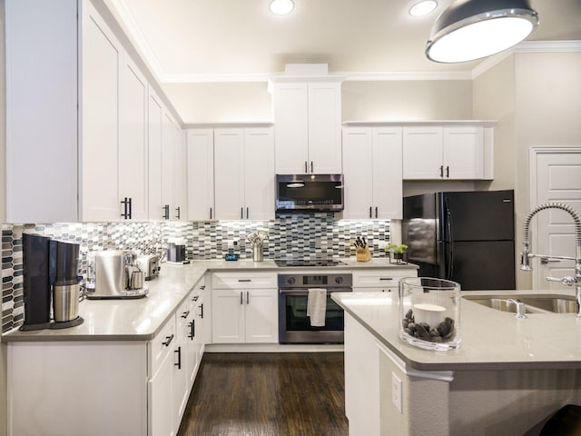 kitchen with white cabinetry, black appliances, and crown molding