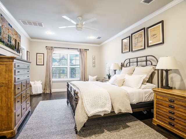 bedroom featuring ornamental molding, dark wood-type flooring, and ceiling fan