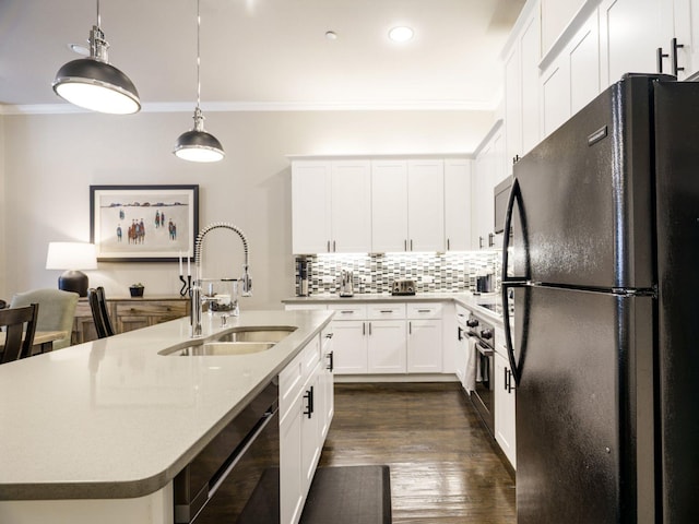 kitchen with sink, black appliances, white cabinets, hanging light fixtures, and ornamental molding