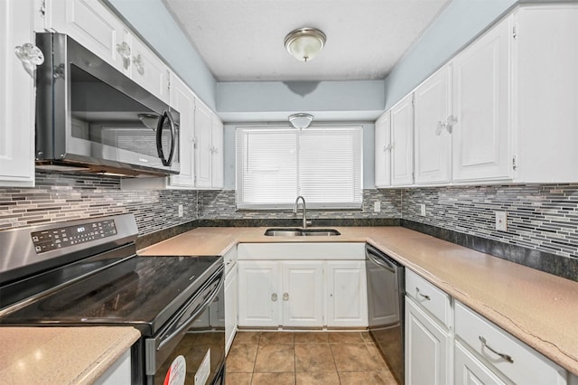 kitchen with white cabinetry and appliances with stainless steel finishes