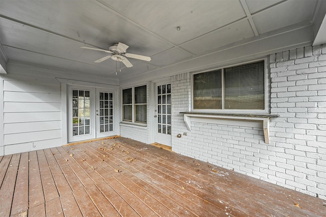 wooden deck featuring ceiling fan and french doors