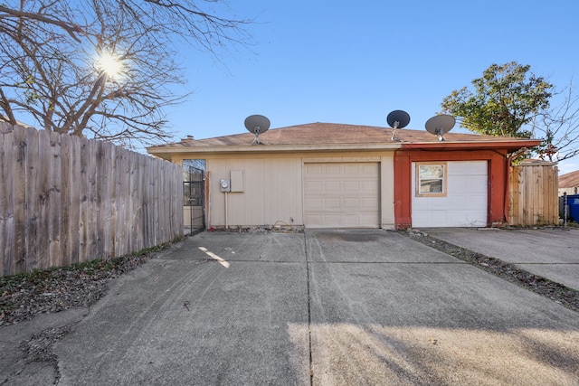 view of side of property with a garage