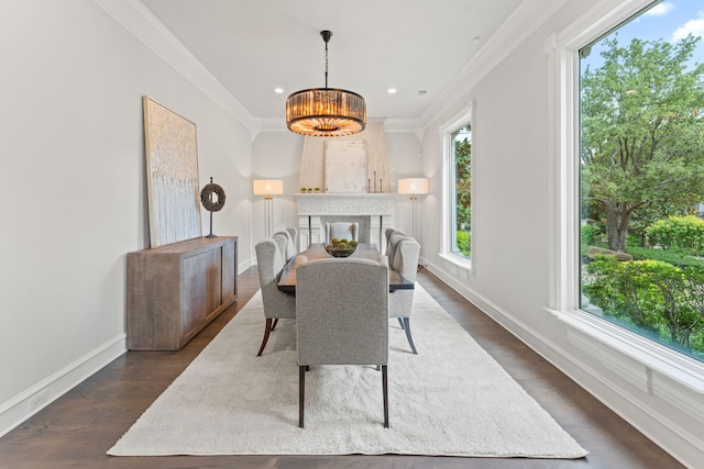 dining area featuring dark hardwood / wood-style floors, a notable chandelier, and ornamental molding