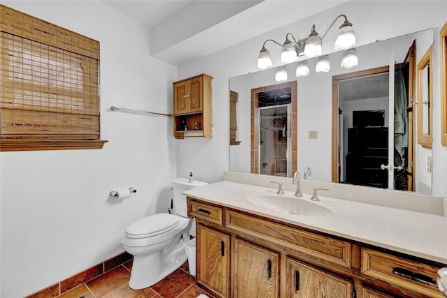 full bathroom featuring tile patterned flooring, a shower stall, toilet, and vanity