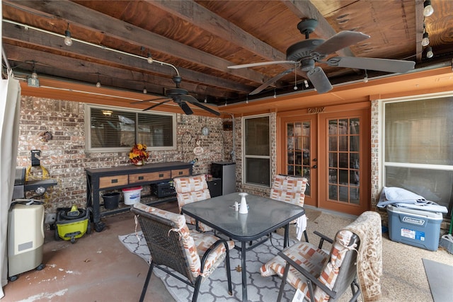 view of patio with a grill, outdoor dining area, and a ceiling fan