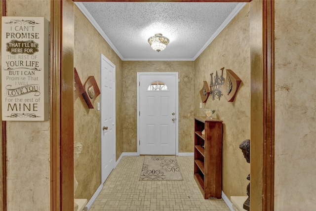 entryway with a textured ceiling, baseboards, and ornamental molding