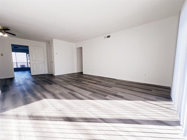 empty room featuring hardwood / wood-style floors and ceiling fan