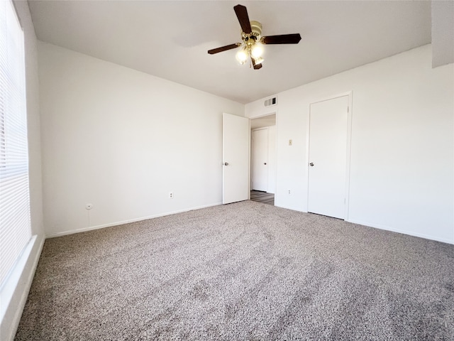 unfurnished bedroom with ceiling fan and carpet flooring