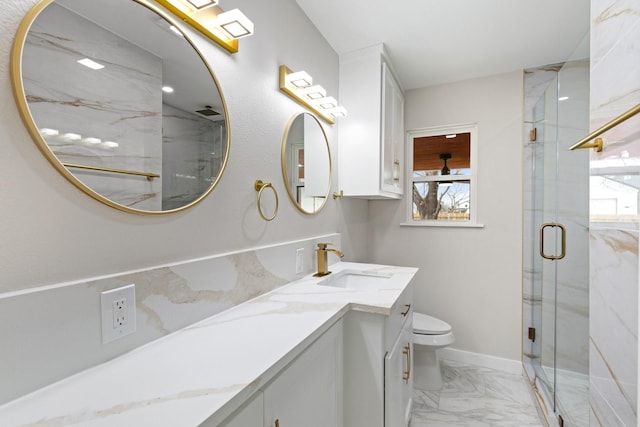 bathroom featuring a shower with door, toilet, and vanity