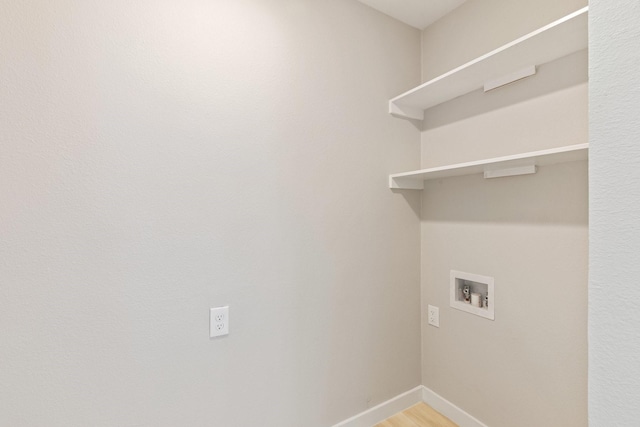 laundry room with hookup for a washing machine and wood-type flooring