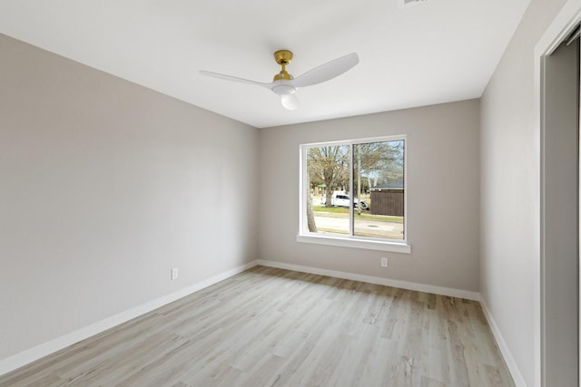 empty room featuring light wood-type flooring and ceiling fan