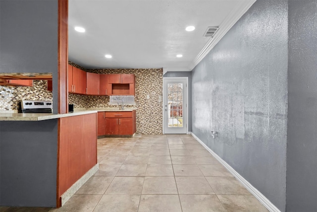 kitchen featuring sink, crown molding, electric range, light tile patterned floors, and backsplash