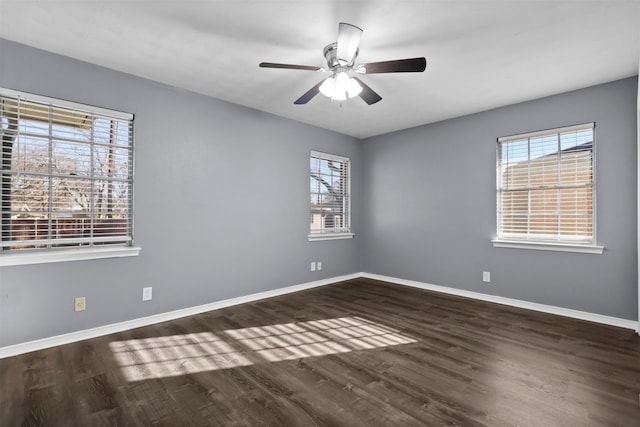 unfurnished room with dark wood-type flooring and ceiling fan