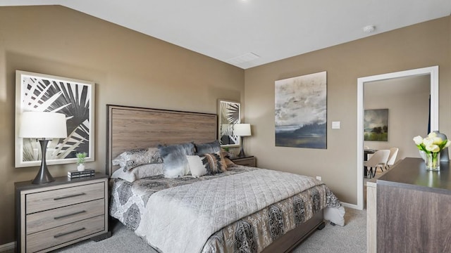 carpeted bedroom featuring lofted ceiling