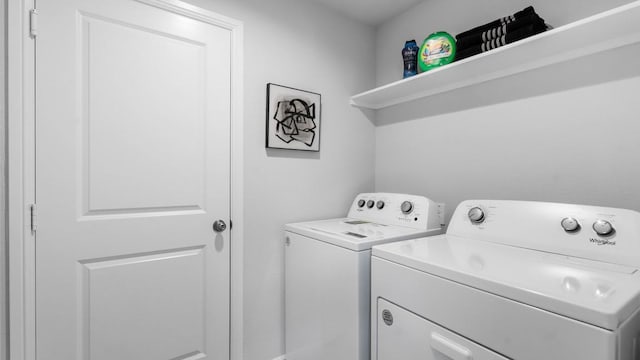 laundry room with separate washer and dryer