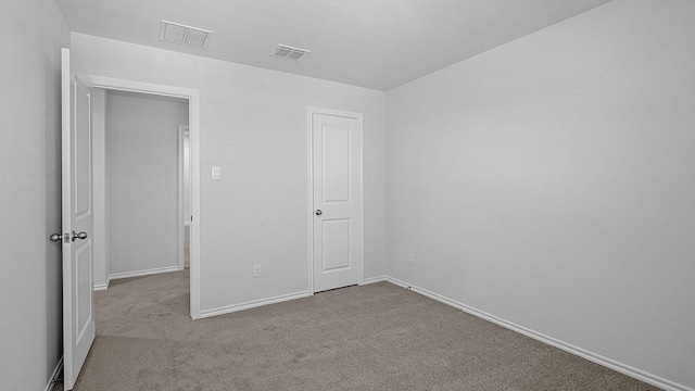 unfurnished bedroom with light carpet