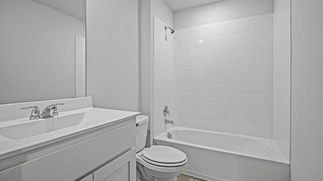 full bathroom featuring vanity, bathing tub / shower combination, and toilet