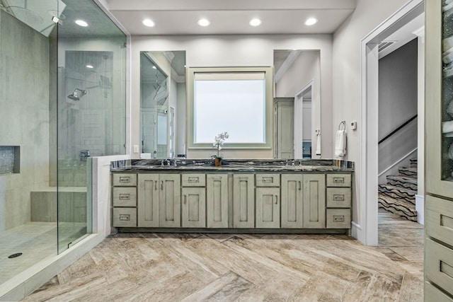 bathroom with an enclosed shower and vanity