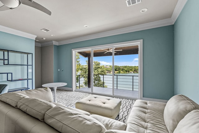 living room featuring ceiling fan and ornamental molding