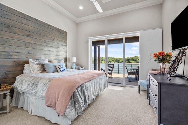 bedroom featuring light carpet, access to exterior, ornamental molding, wood walls, and ceiling fan