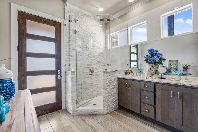 bathroom with vanity and an enclosed shower