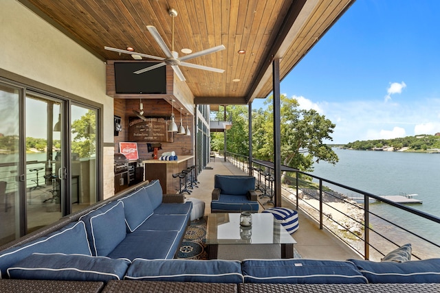 view of patio / terrace featuring an outdoor living space, ceiling fan, and exterior bar