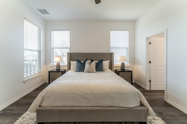 bedroom featuring dark hardwood / wood-style floors and ceiling fan