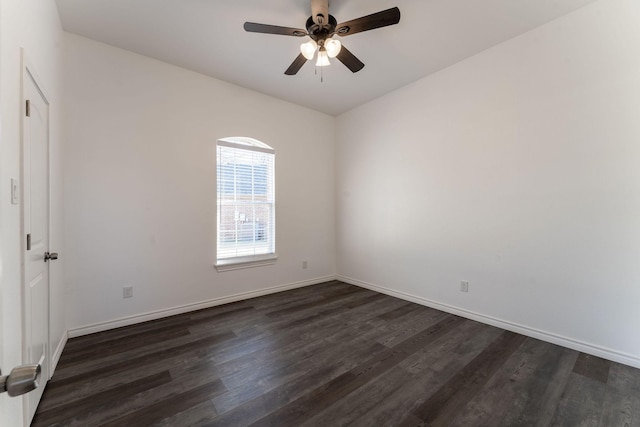 empty room featuring ceiling fan and dark hardwood / wood-style flooring