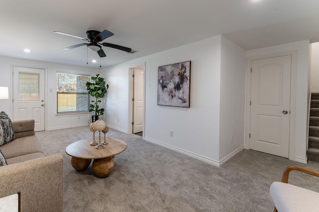 living room with light carpet and ceiling fan