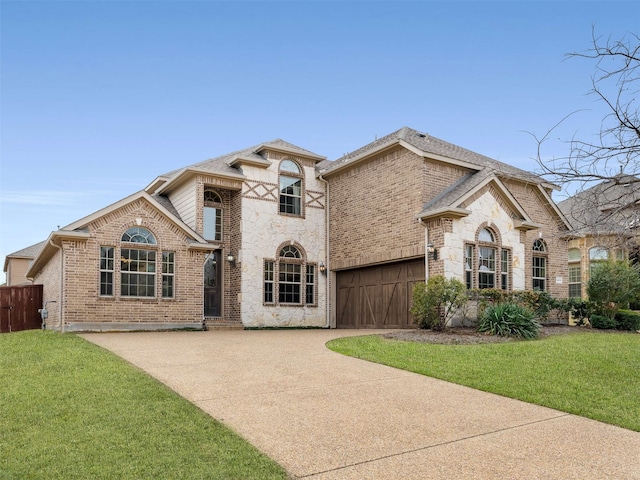 view of front of property with a garage and a front yard