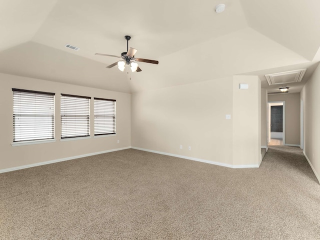 carpeted empty room with ceiling fan and lofted ceiling