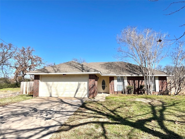 ranch-style home with a garage and a front lawn