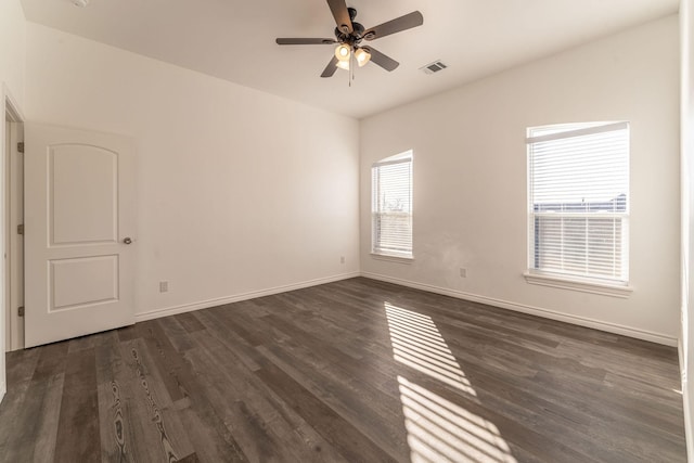 unfurnished room featuring ceiling fan and dark hardwood / wood-style floors