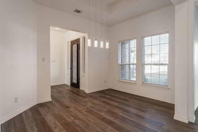 unfurnished room with dark hardwood / wood-style flooring