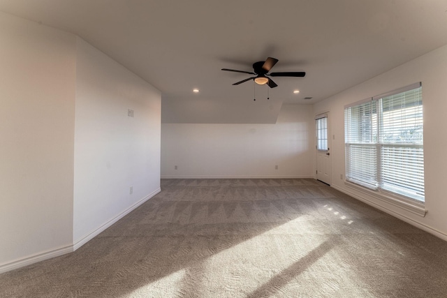 spare room with ceiling fan and carpet floors