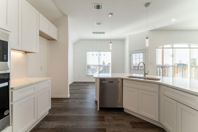 kitchen with sink, dishwasher, white cabinets, and pendant lighting