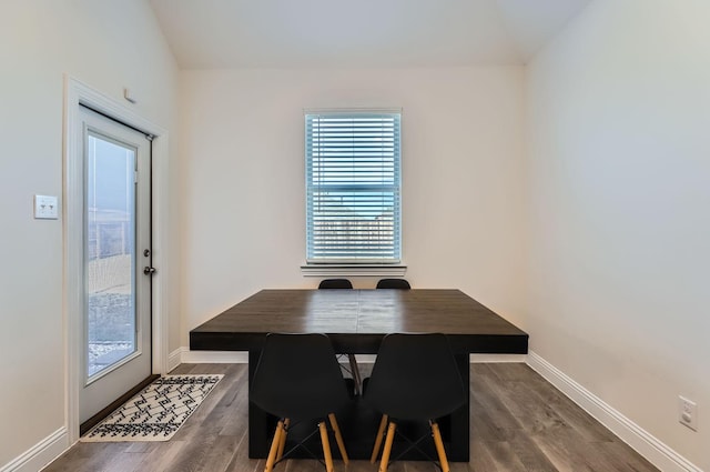 dining area with dark hardwood / wood-style flooring