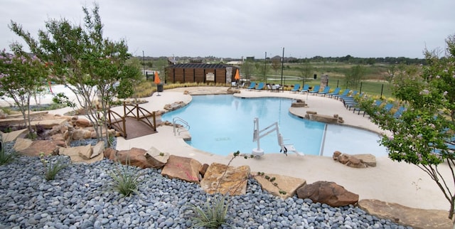 view of swimming pool featuring a patio