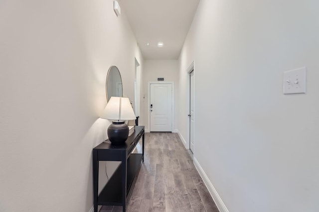 corridor featuring light hardwood / wood-style floors