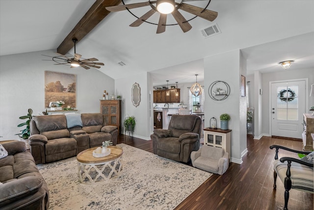 living room featuring ceiling fan with notable chandelier, dark hardwood / wood-style floors, and lofted ceiling with beams