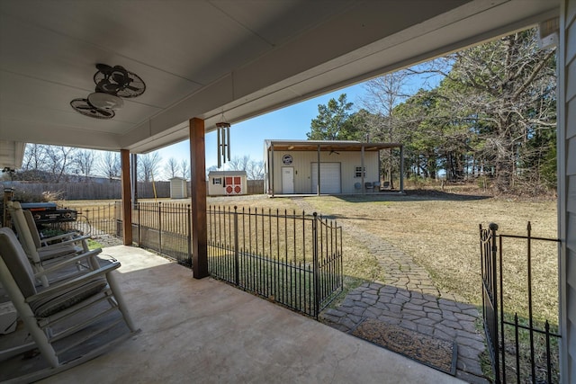 view of patio / terrace featuring a storage shed