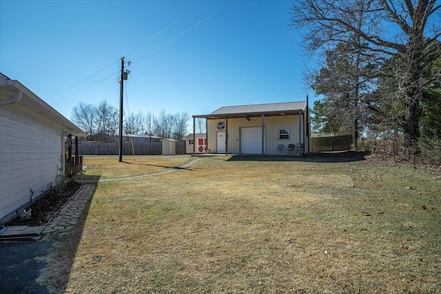 view of yard featuring a shed and a garage